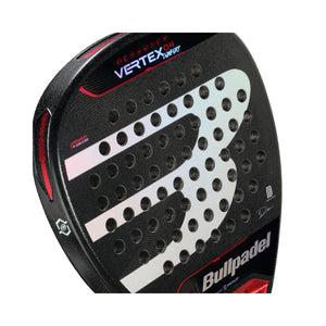 Close-up of the Bullpadel Vertex 04 Comfort 2024 Martín Di Nenno padel racket, featuring a black design with a large B logo. This diamond-shaped racket has a Top Spin surface, circular holes, and red and silver accents, with the brand name on the lower right.