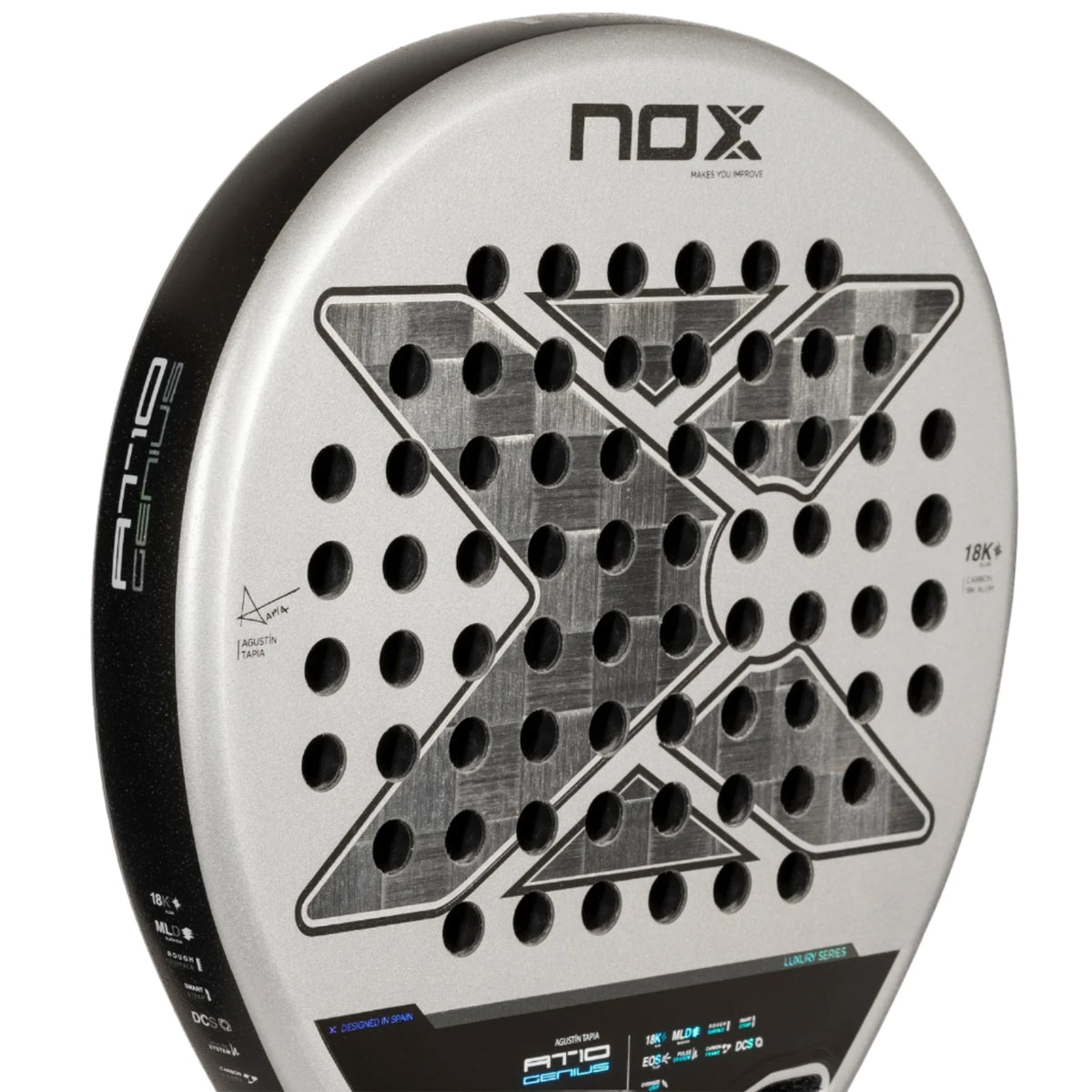 A close-up of the NOX Padel Racket AT10 Genius 18K by Agustin Tapia 2024 reveals a metallic-finished aluminized carbon fiber construction. It features an X pattern, circular holes, branding text, and subtly integrated EOS Flap technology with technical specs on the frame.