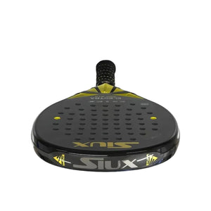Front view of the sleek black Siux Padel Racket Electra Pro ST3 2024 Franco Stupa with striking yellow accents, endorsed by Franco Stupaczuk; features a grid of small holes, a textured black grip, and bold Siux branding in yellow and gray.