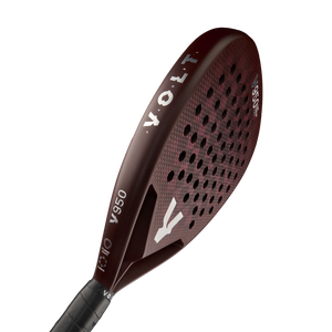 The dark red VOLT 950 V23 padel racket by Volt features a grid pattern of holes for power and control, tailored for advanced players. The brand name and model number appear in white on the surface, paired with a sleek black handle.