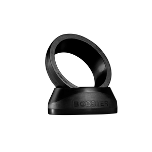 The sleek VOLT BOOSTER by Volt is a black ring with BOOSTER embossed, angled on a matching base against a dark backdrop. This padel racket accessory combines modern aesthetics with a power boost for your game.