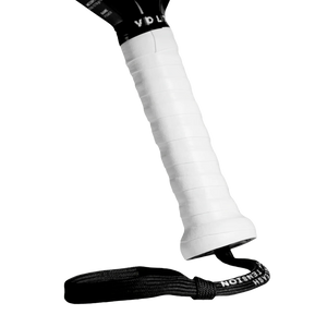 A close-up of the Volt VOLT BOOSTER pickleball paddle handle wrapped in white grip tape with a power boost touch. A black wrist strap, like a supercharger smash cap, is attached at the base, set against a sleek black background.